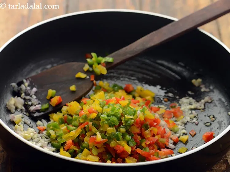 Step 16 – Add coloured capsicum. Bellpeppers will help in making the risotto colorful and beautiful, also will …