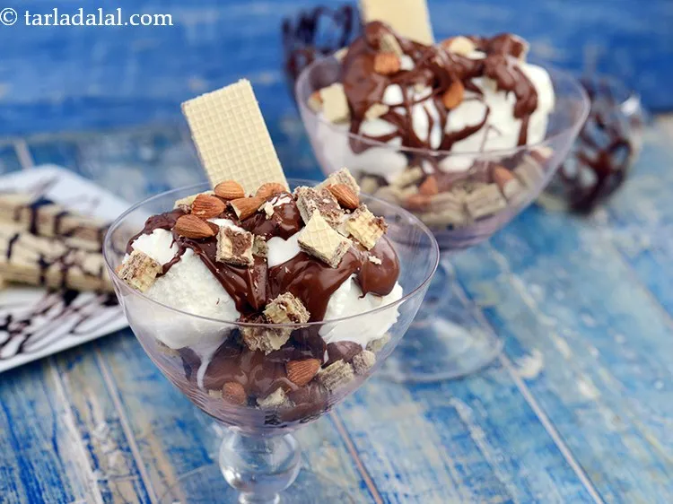 Step 8 – Serve <strong>super easy</strong> <strong>brownie sundaes</strong> immediately garnished with 2 tbsp of roasted almond halves. They …