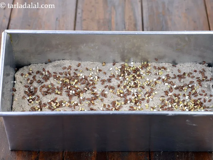 Step 22 – Also sprinkle 2 tsp&nbsp;<a href="https://www.tarladalal.com/glossary-buckwheat-kuttu-kutti-no-daro-kutto-427i">buckwheat (kuttu or kutti no daro)</a>&nbsp;evenly over it.