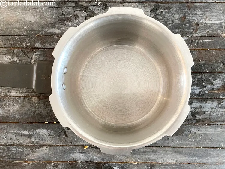 Step 18 – Heat 1 tsp oil in a pressure cooker.