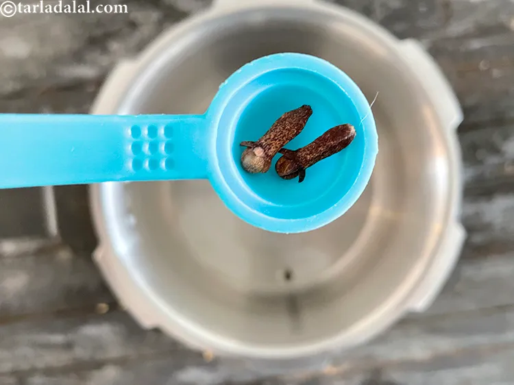 Step 20 – Add&nbsp;<meta charset="UTF-8" />1 to 2&nbsp;<a href="glossary-cloves-322i">cloves (laung / lavang)</a>.