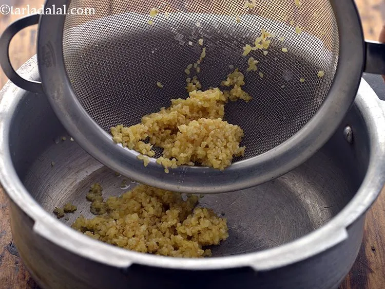 Step 9 – Add the bulgur wheat into a pressure cooker.&nbsp;