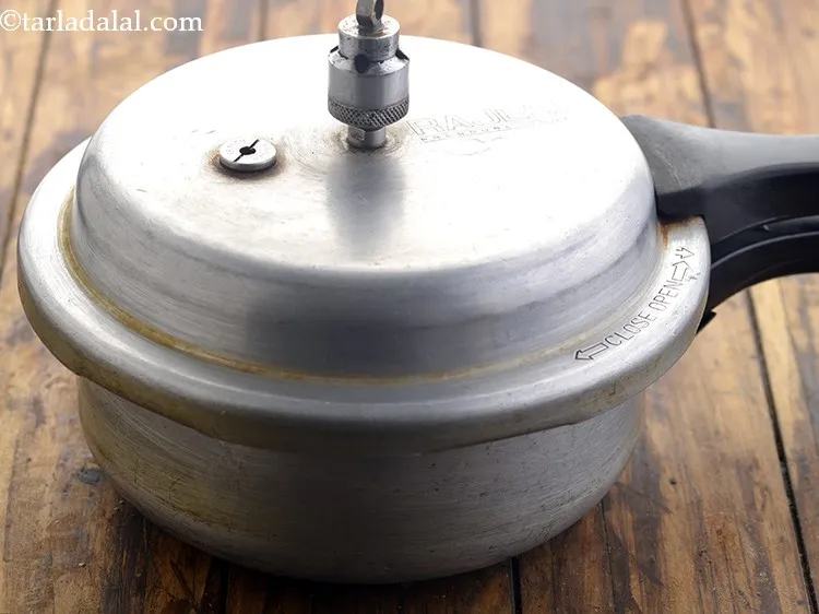 Step 15 – Close the lid of the pressure cooker and pressure cook for 3 whistles. Allow the …
