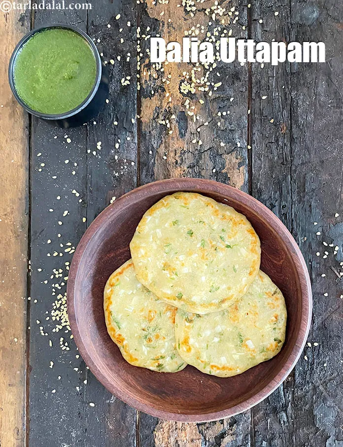 Step 43 – Serve&nbsp;<strong>dalia uttpam |&nbsp;healthy bulgar wheat uttpam&nbsp;| &nbsp;dalia vegetable uttapam |&nbsp;dalia&nbsp;snack recipe&nbsp;|&nbsp;</strong>hot with <a href="https://www.tarladalal.com/green-chutney-22266r">green chutney</a>.