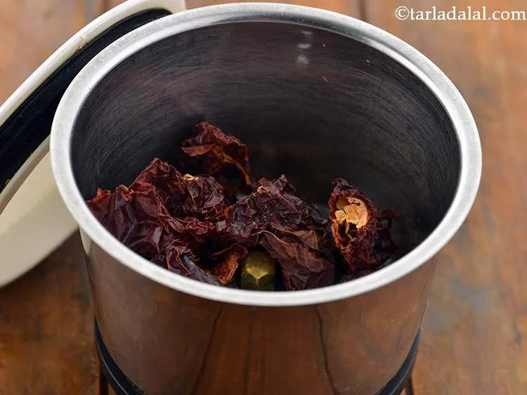 Step 2 – For the khowsuey curry, we would require a paste, for that in a mixer jar …