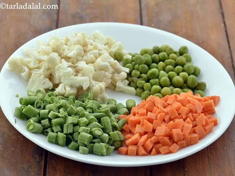 Step 12 – Chop the french beans, carrot, green peas and cauliflower. You can use any vegetables of …
