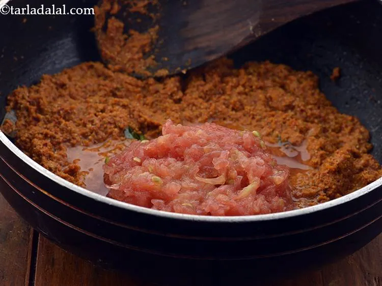 Step 20 – Add the tomatoes. They provide a nice tangy flavor to the coconut curry.