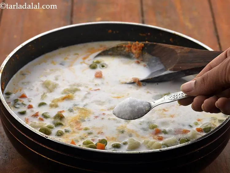 Step 23 – Add the coconut milk and salt. <a href="https://www.tarladalal.com/Coconut-Milk-(-Thai-Cooking-)-428r" target="_blank">Coconut milk</a> can be prepared at home …