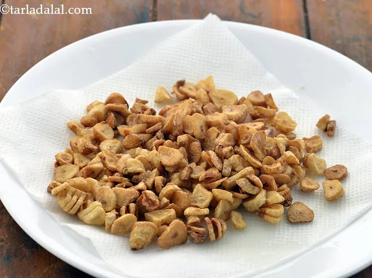 Step 31 – Heat the oil in a deep non-stick pan on a medium flame. Lower the flame, …