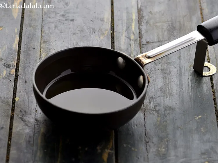 Step 4 – Take approx. &frac14; cup of oil in a small pan.
