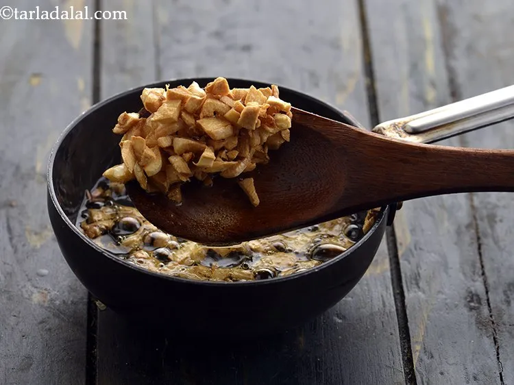 Step 33 – Garlic should be chopped very well and fried till light brown to give crispiness.&nbsp;
