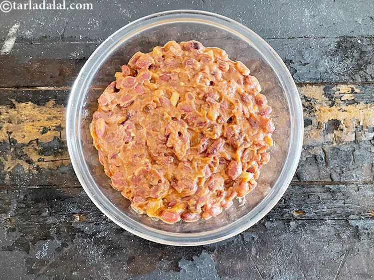 Step 81 – Top with refried beans and layer over.&nbsp;