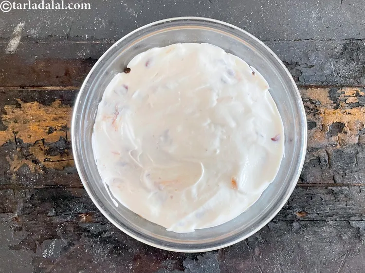 Step 83 – Top with sour cream.&nbsp;Use the back of a spoon to flatten the sour cream.