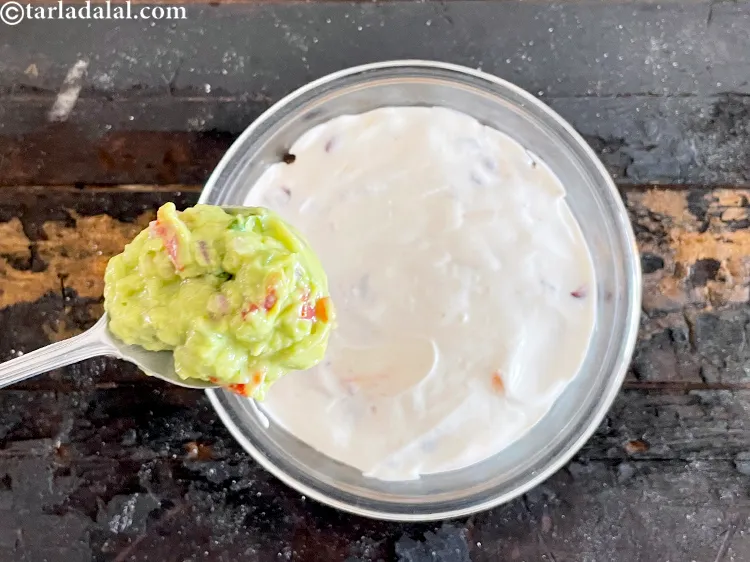 Step 95 – You can also make a layer of <a href="https://www.tarladalal.com/guacamole-mexican-avocado-dip-1239r" target="_blank"><strong>guacamole </strong></a>if you wish.&nbsp;