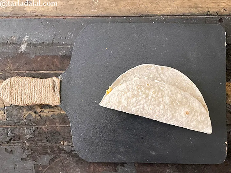 Step 126 – Fold the tortilla from the stuffed side 75% towards the other end. We are going …