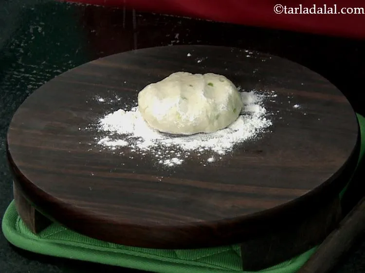 Step 15 – Sprinkle a little flour on the rolling board. Take a portion of the dough and …
