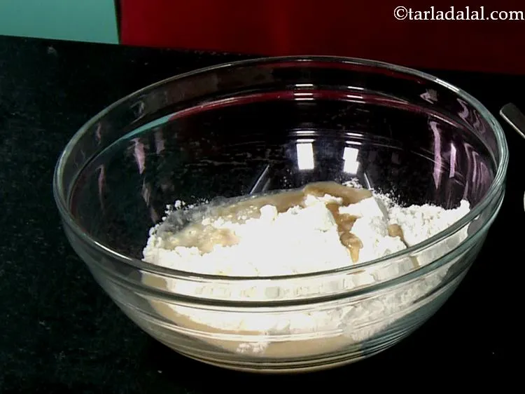 Step 6 – Now add the yeast-sugar mixture which is the raising agent for this <strong>Butter Garlic Naan …