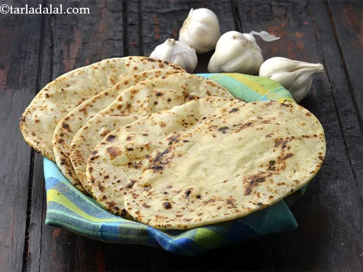Step 22 – Brush each naan with a little melted butter (about 1/2 tsp on each naan) and …