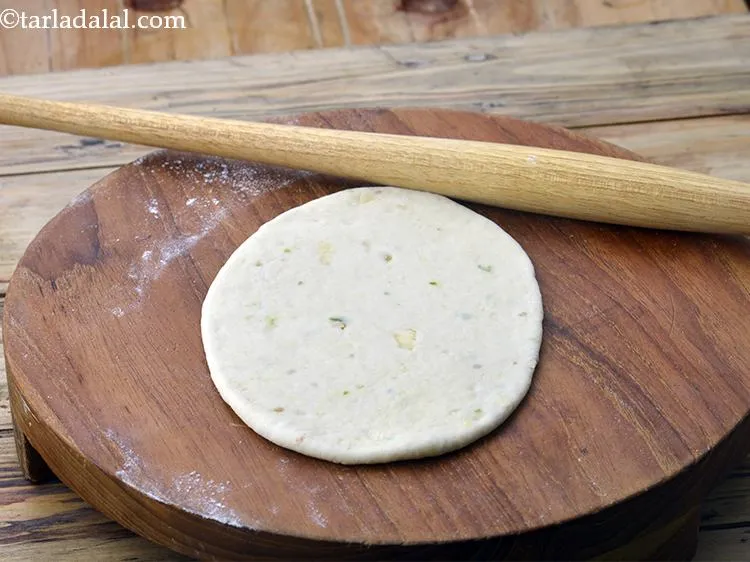 Step 16 – Roll the Naan out into an oblong of 125 mm. (5").