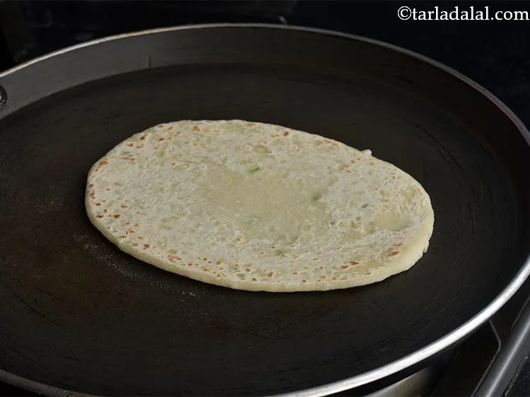 Step 19 – Turn it over and cook it on the other side till it puffs a little …