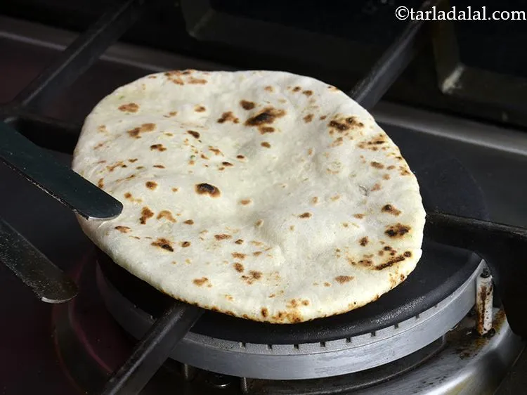 Step 20 – Roast the naan on an open flame. It should turn golden brown on both the …