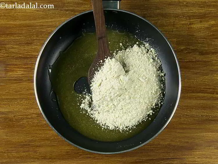Step 4 – Remove the pan from the flame and add the <strong>cashewnuts</strong>. Keeping the pan on the …