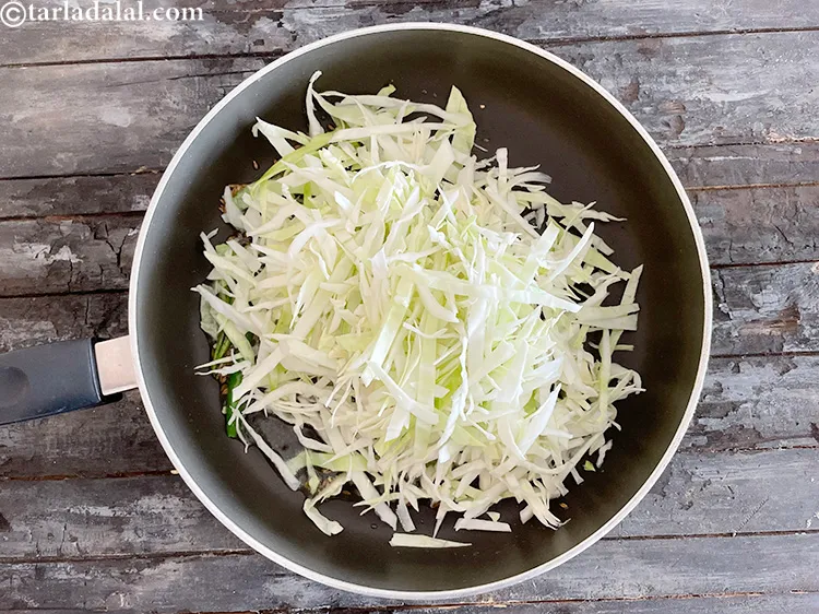 Step 23 – Add&nbsp;<meta charset="UTF-8" />3 cups&nbsp;<a href="glossary-shredded-cabbage-763i">shredded cabbage</a>.