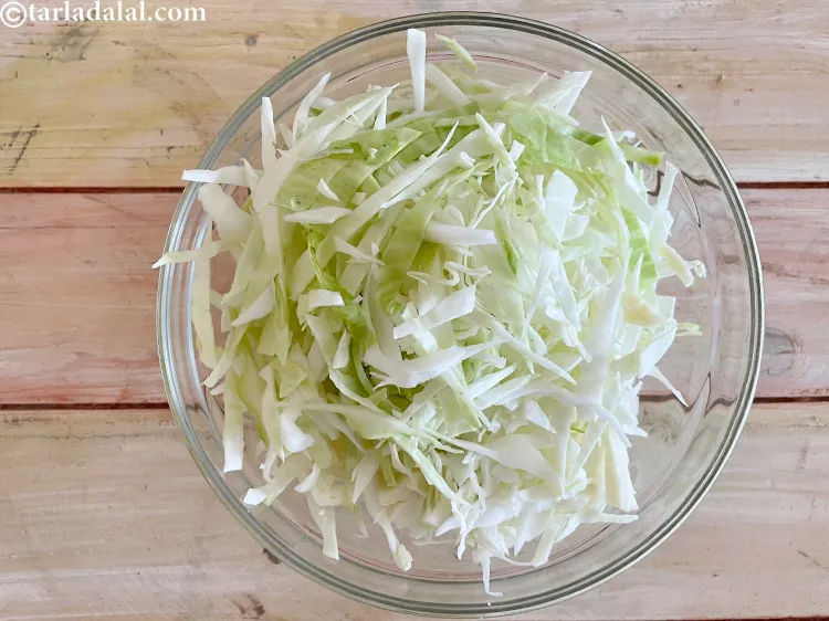 Step 13 – We have&nbsp;<meta charset="UTF-8" />3 cups&nbsp;<a href="glossary-shredded-cabbage-763i">shredded cabbage</a>.&nbsp;Place the cabbage on a chopping board and with …
