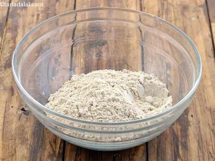 Step 7 – To make the dough for <strong>cabbage and dal paratha,</strong> in a deep bowl take whole …