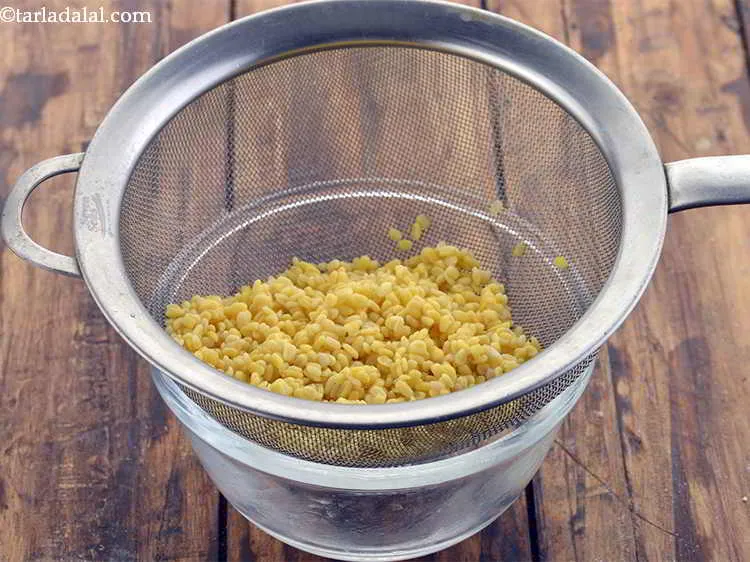 Step 3 – Drain well. The dal water can be used to make the dough.