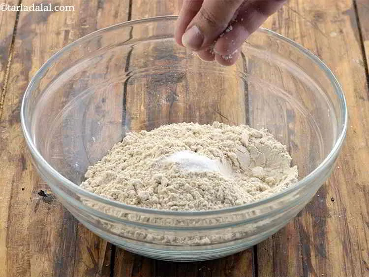 Step 8 – To this add salt to taste and mix it very well with your fingertips.