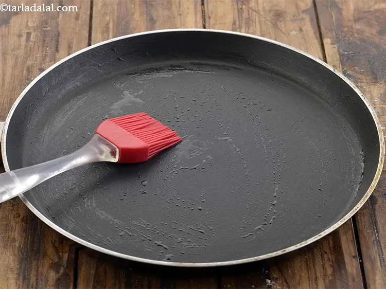 Step 29 – Heat a non-stick tava (griddle) and grease it using a little oil.