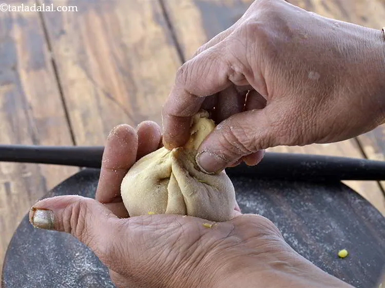 Step 27 – Remove the excess dough and seal it tightly.