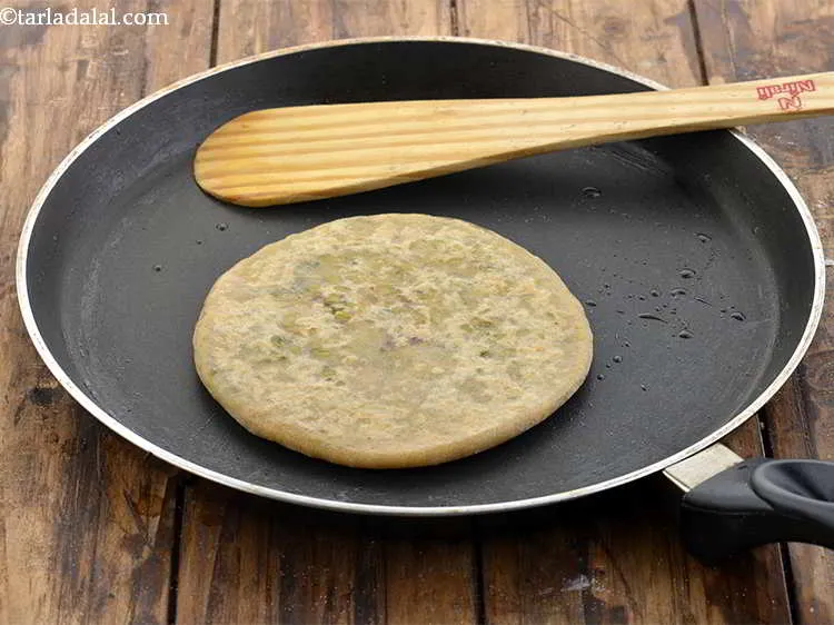 Step 29 – Cook&nbsp;<strong>cabbage and dal paratha&nbsp;</strong>on a non-stick pan on both sides using &frac14; teaspoon oil until …