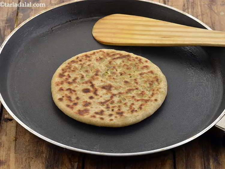 Step 30 – Repeat with the remaining dough and stuffing to make 4 more&nbsp;<strong>cabbage and dal parathas</strong>.
