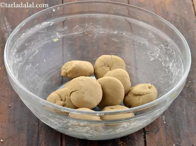 Step 12 – Divide the dough into 10 equal portions and shape them into balls.