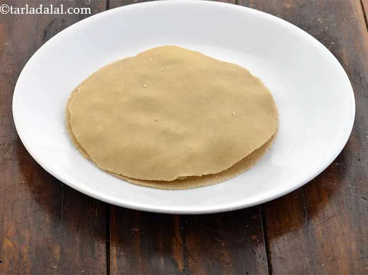 Step 18 – Place 1 more roti over the stuffing.