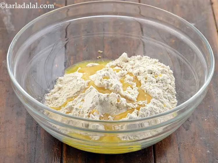 Step 2 – To this add salt to taste and ghee. Mix this well with your hands so …