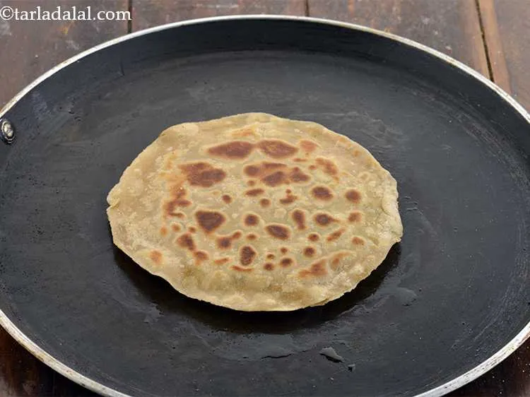 Step 22 – Now, using 1 tsp oil, cook the paratha on both sides, on a slow flame, …