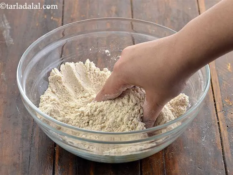 Step 2 – To this add salt to taste and ghee. Mix this well with your hands so …