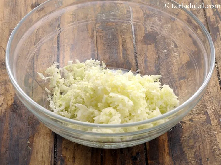 Step 1 – To prepare the <strong>stuffing for cabbage and paneer rolls</strong>, in a deep bowl take grated …