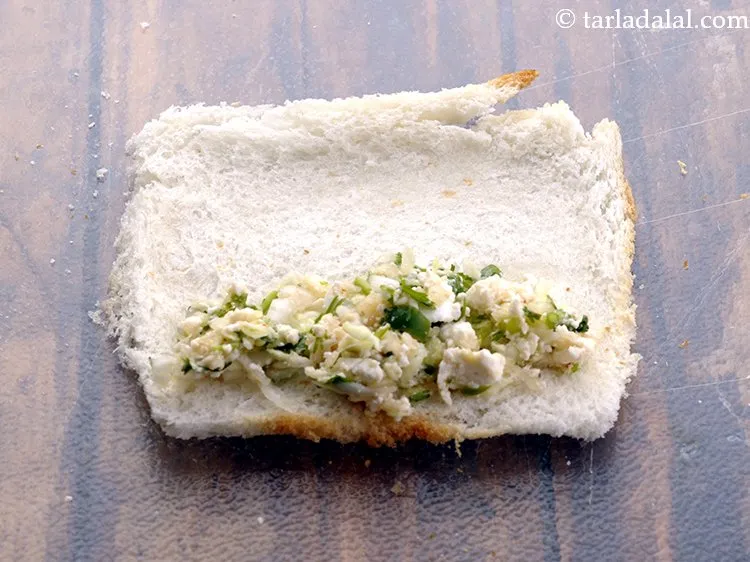 Step 16 – To make <strong>cabbage and paneer rolls</strong>, put approx. 2 tsp of the stuffing on one …