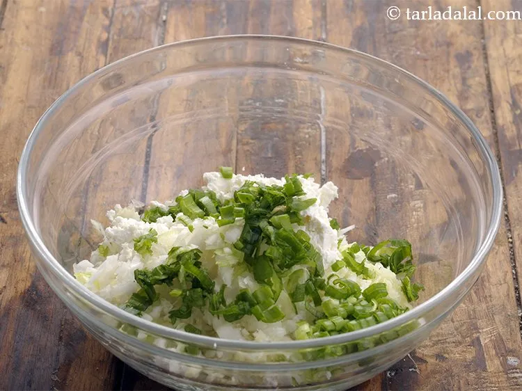 Step 4 – Add finely chopped spring onion greens. You can add any other veggies of your choice …