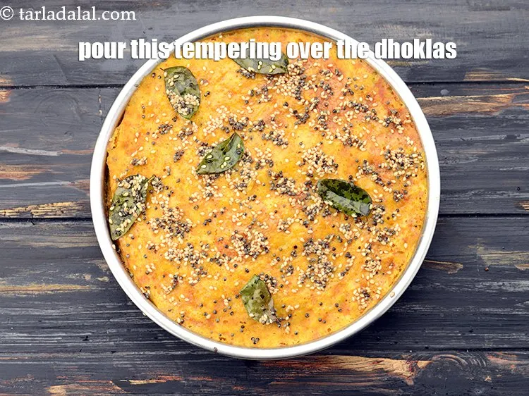 Step 27 – Pour this tempering over the dhoklas.