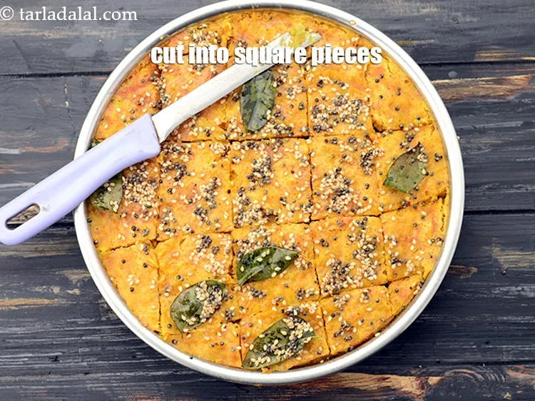 Step 32 – Before cutting the dhokla into pieces make sure you allow them to cool atleast for …
