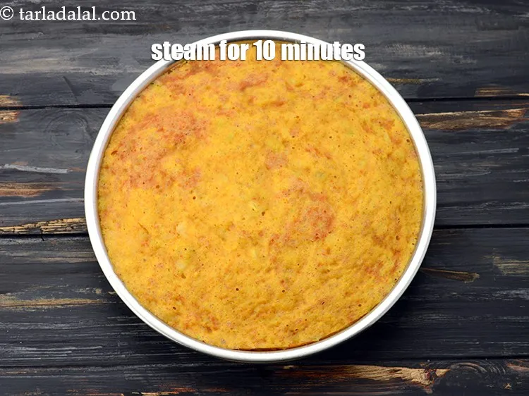 Step 19 – Steam in a steamer for 10 minutes or till the dhoklas are cooked. Keep aside …