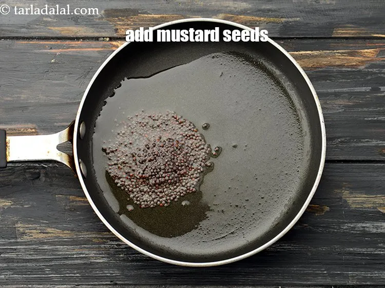 Step 21 – Add 1 tsp&nbsp;<a href="https://www.tarladalal.com/glossary-mustard-seeds-sarson-rai-sarson-ke-beej-525i">mustard seeds ( rai / sarson)</a>.&nbsp;