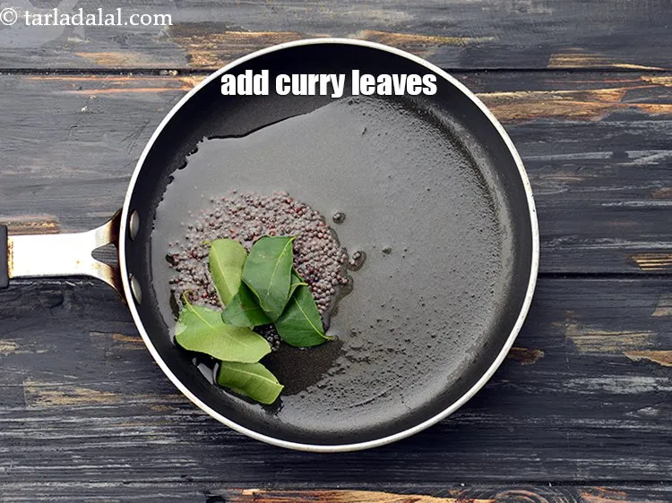 Step 22 – Add 5 to 6&nbsp;<a href="https://www.tarladalal.com/glossary-curry-leaves-kadi-patta-kadipatta-388i">curry leaves (kadi patta)</a>.