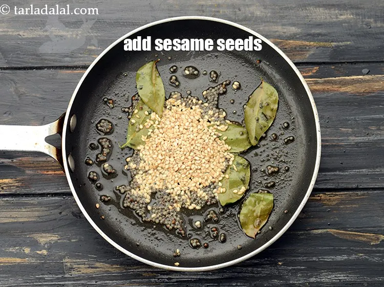 Step 25 – Add 1 tsp&nbsp;<a href="https://www.tarladalal.com/glossary-sesame-seeds-til-gingelly-seeds-612i">sesame seeds (til)</a>.