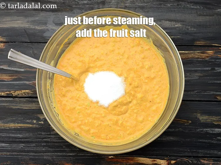 Step 14 – Just before steaming, add 1 tsp&nbsp;<a href="https://www.tarladalal.com/glossary-fruit-salt-420i">fruit salt</a>.&nbsp;